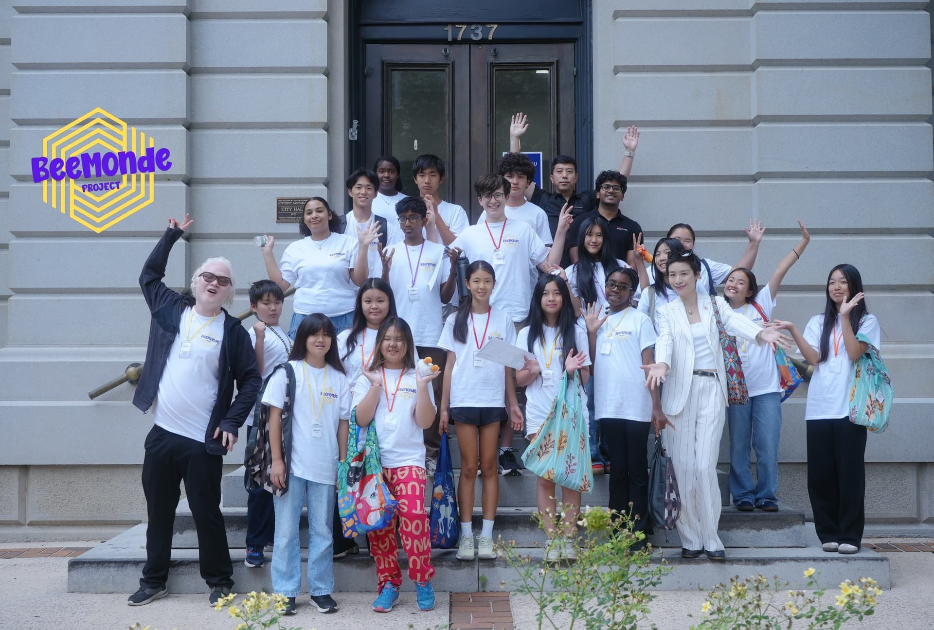 Students posing together on the steps of Columbia City Hall during an Inspire Columbia summer program