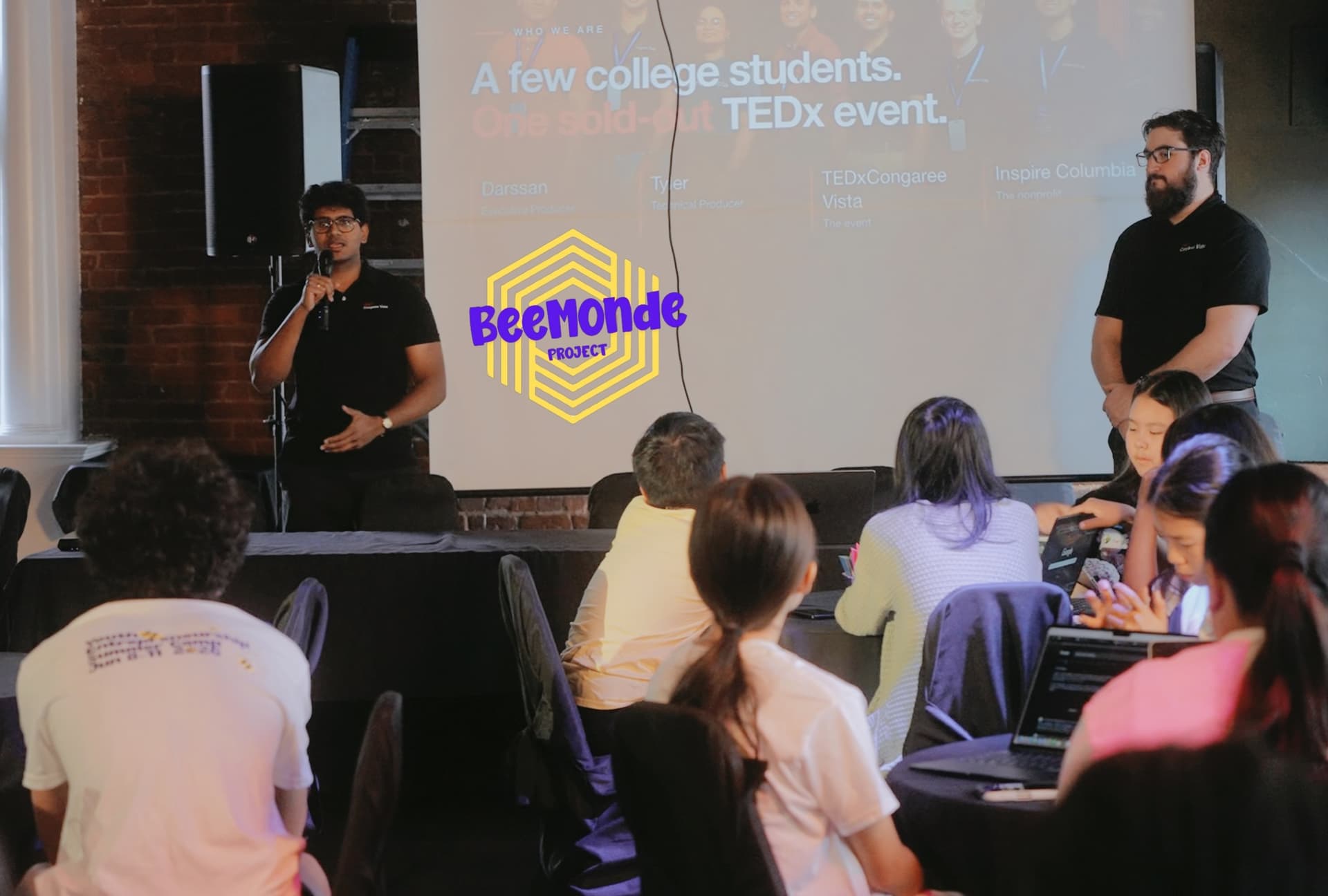 Inspire Columbia leaders presenting to a room of students