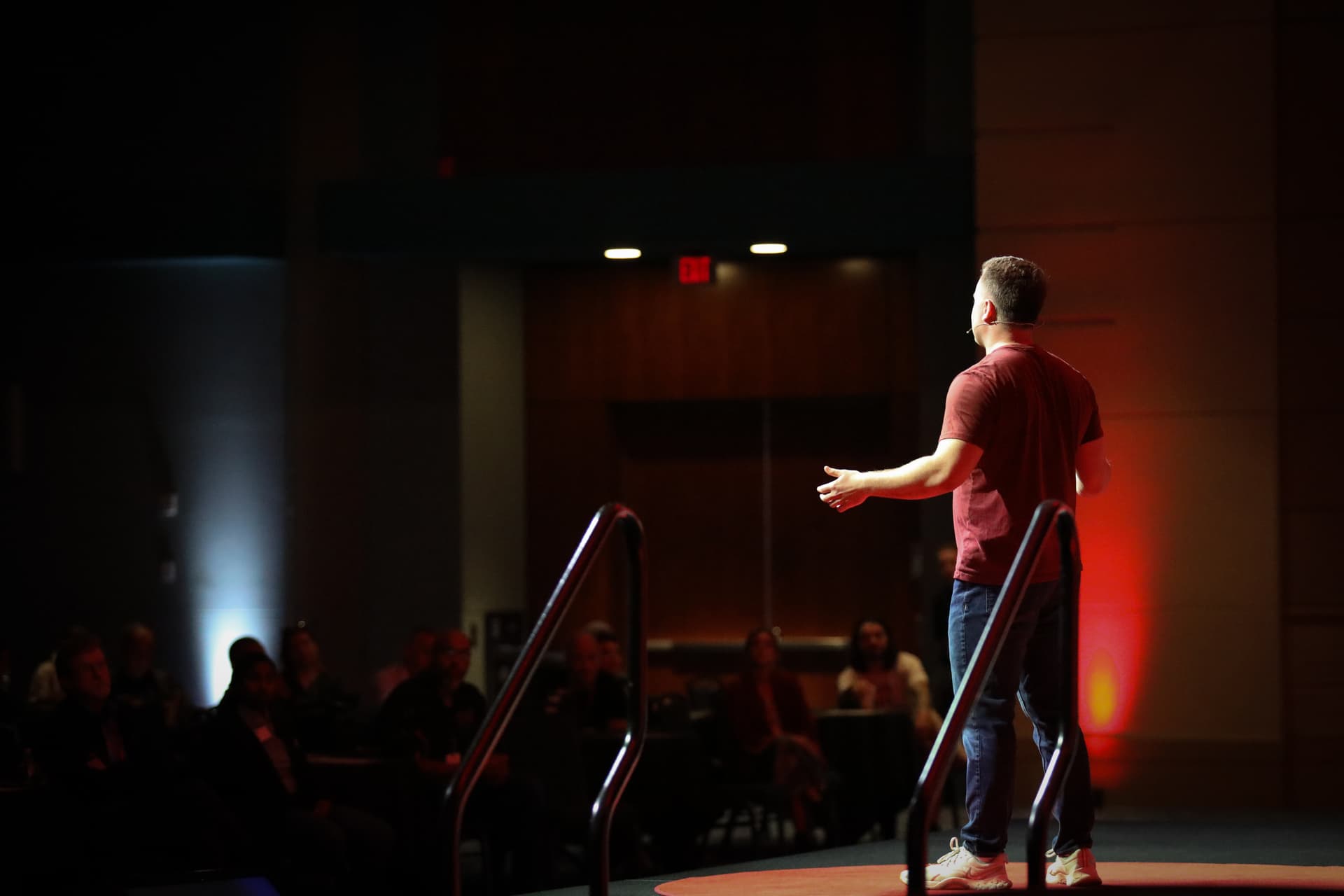 A speaker addressing the audience from the TEDxCongaree Vista stage